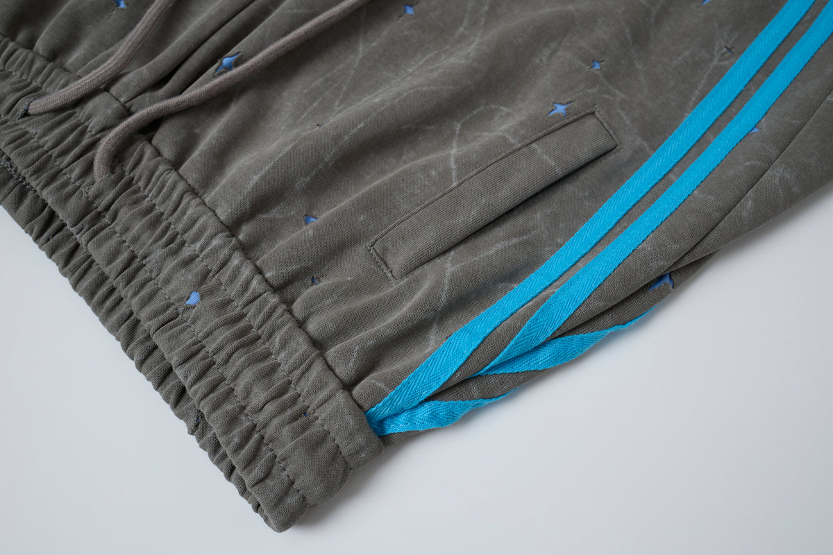 Women’s Cosmic Drift Star-Print Cargo Pants – Washed Gray Baggy Barrel Pants with Blue Racing Stripes