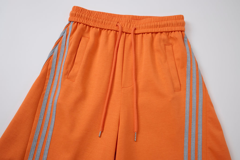 Women’s Retro Orange Striped Wide-Leg Track Pants with Adjustable Cinch Hems