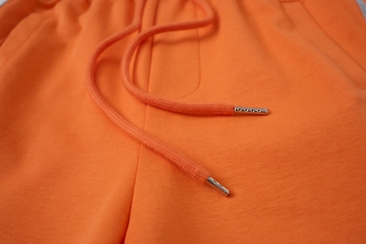 Women’s Retro Orange Striped Wide-Leg Track Pants with Adjustable Cinch Hems